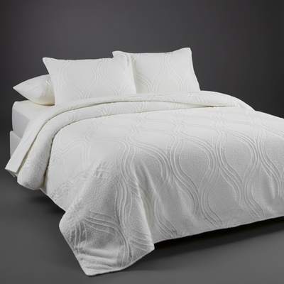 White bedcover with dark grey background