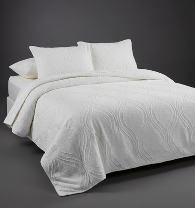 White bedcover with dark grey background